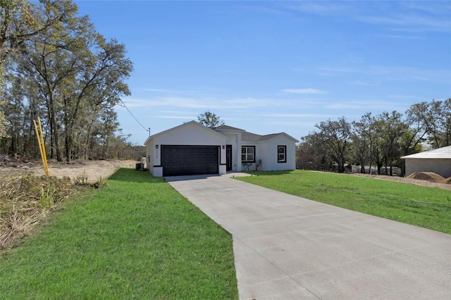 view of front of house featuring a front yard and a garage