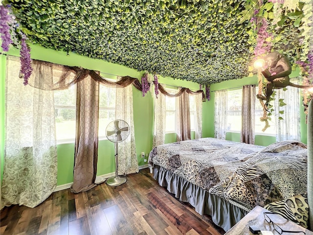 bedroom with dark wood-type flooring