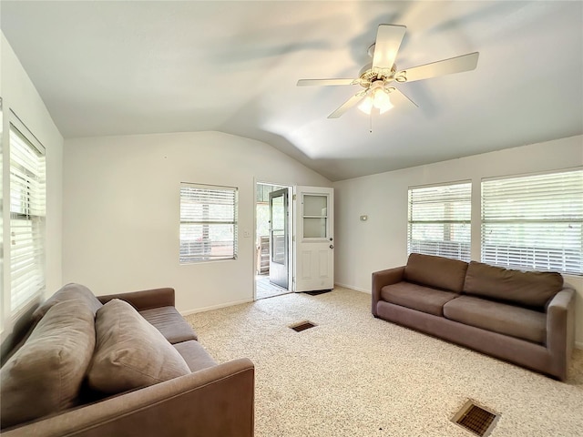 living room with ceiling fan, plenty of natural light, and light colored carpet