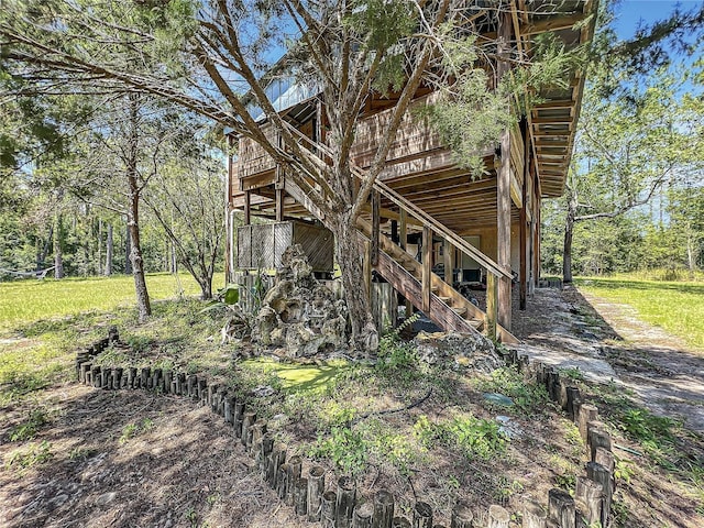 view of side of home with a deck