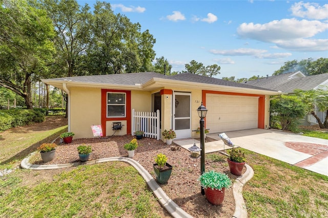 single story home featuring a garage