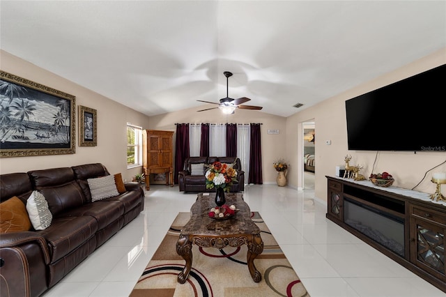 living room featuring light tile patterned floors, ceiling fan, and lofted ceiling