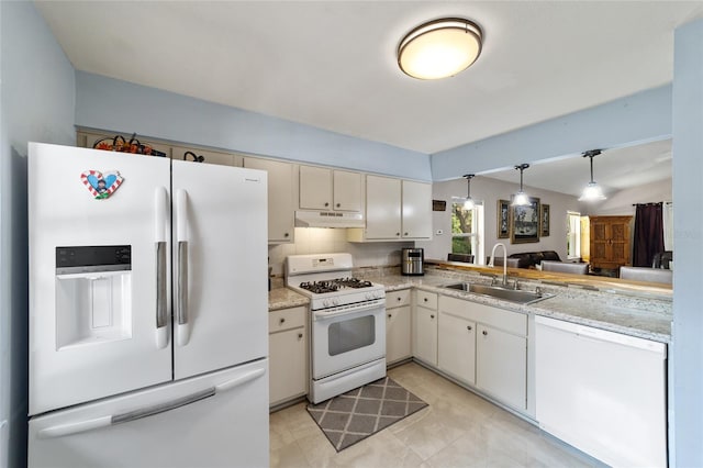 kitchen featuring sink, hanging light fixtures, tasteful backsplash, kitchen peninsula, and white appliances