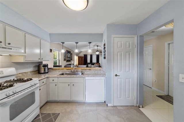 kitchen featuring tasteful backsplash, white appliances, extractor fan, sink, and white cabinets