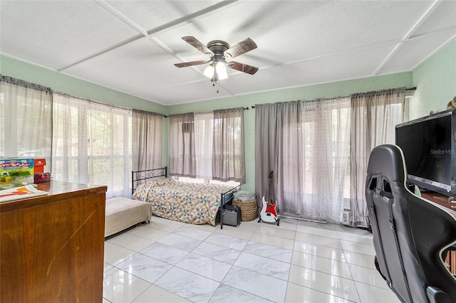 bedroom featuring multiple windows, light tile patterned floors, and ceiling fan