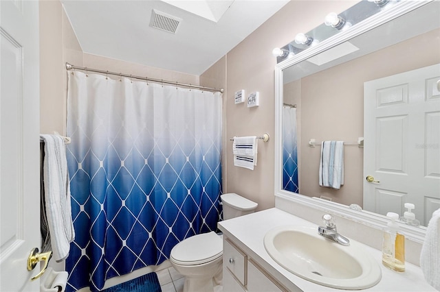 bathroom with tile patterned floors, vanity, toilet, and a shower with curtain