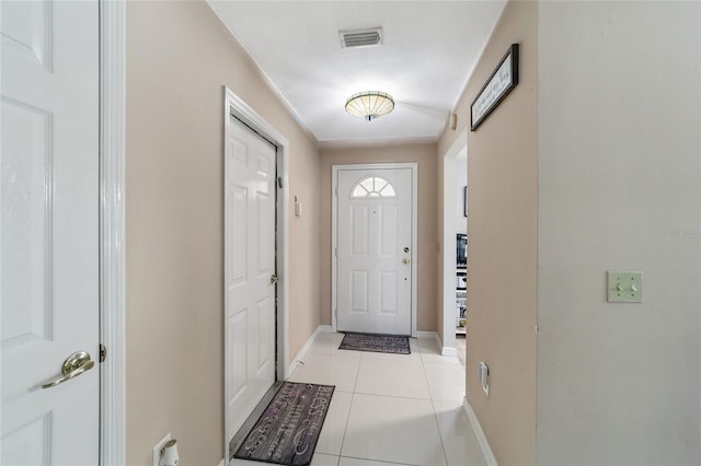 doorway featuring light tile patterned floors