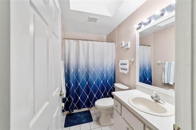 bathroom with tile patterned flooring, vanity, a shower with shower curtain, and toilet