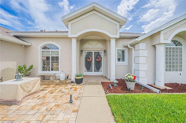 property entrance featuring a patio area