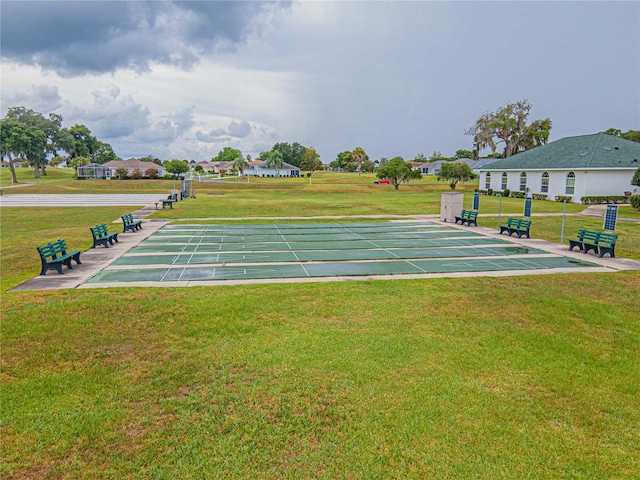 view of community featuring a lawn