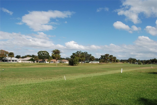 view of property's community with a lawn