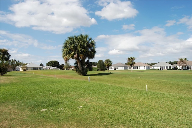 view of home's community featuring a lawn