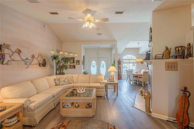 5495 NW 23rd Pl, Ocala, FL 34482 - living area featuring vaulted ceiling, visible vents, wood finished floors, and ceiling fan