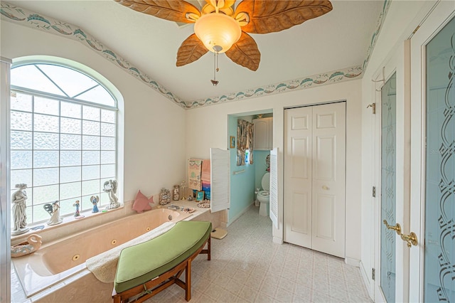 5495 NW 23rd Pl, Ocala, FL 34482 - full bathroom featuring ceiling fan, a whirlpool tub, and toilet