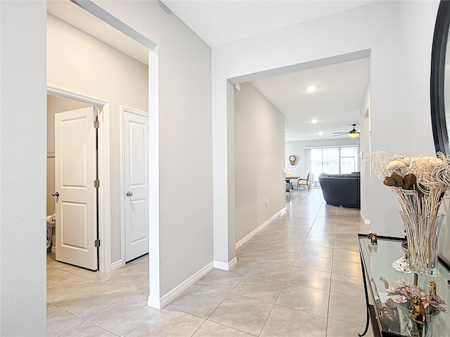 hallway featuring light tile patterned floors