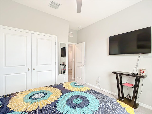 carpeted bedroom with a closet and ceiling fan