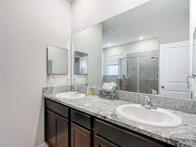 bathroom with vanity and walk in shower