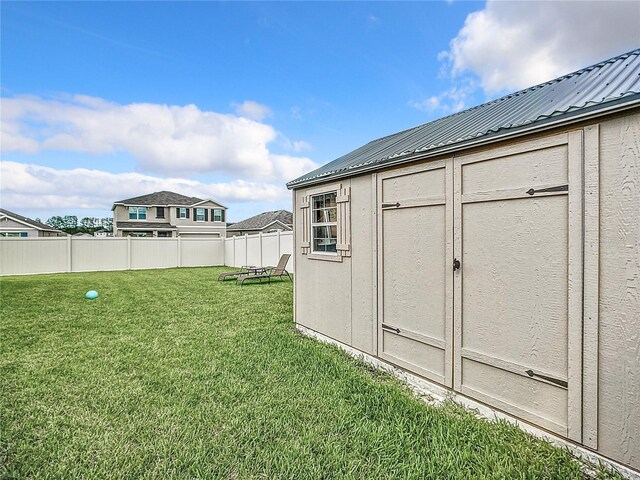 view of yard with a storage shed