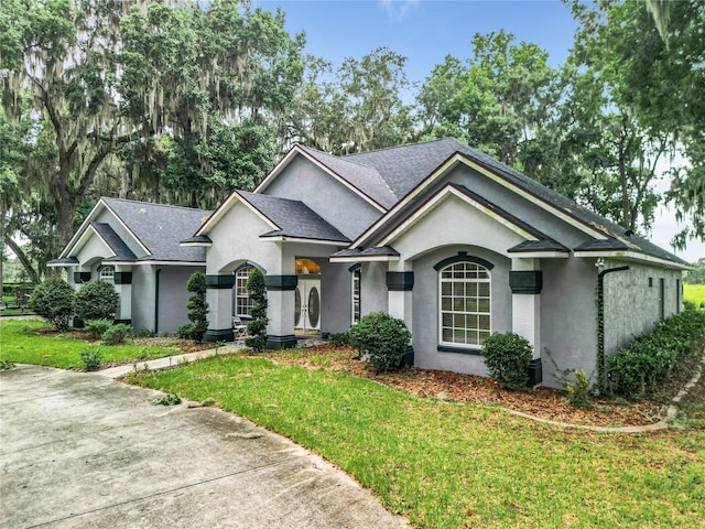 ranch-style house with a front lawn