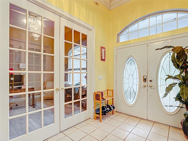 tiled entrance foyer with french doors and a wealth of natural light