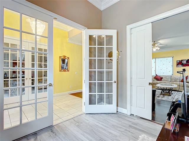 doorway to outside featuring ceiling fan, light hardwood / wood-style floors, ornamental molding, and french doors