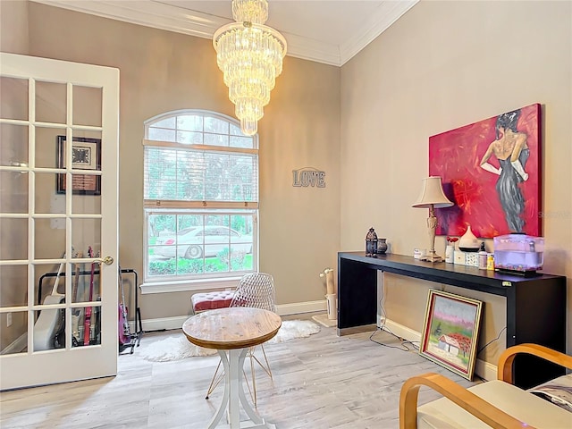 interior space featuring wood-type flooring, crown molding, and a notable chandelier