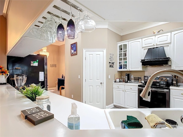 kitchen featuring white cabinets, fridge, stainless steel range with electric stovetop, and crown molding