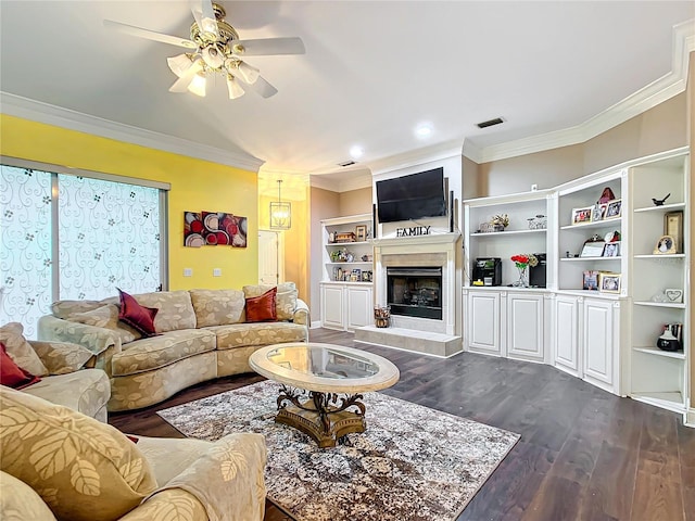 living room with ceiling fan, dark hardwood / wood-style flooring, and ornamental molding