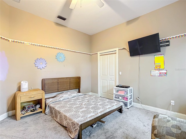 bedroom with ceiling fan and light colored carpet