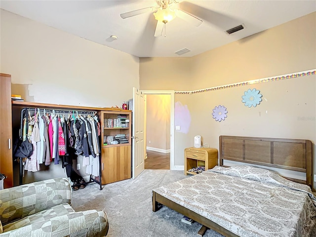 carpeted bedroom with a closet and ceiling fan