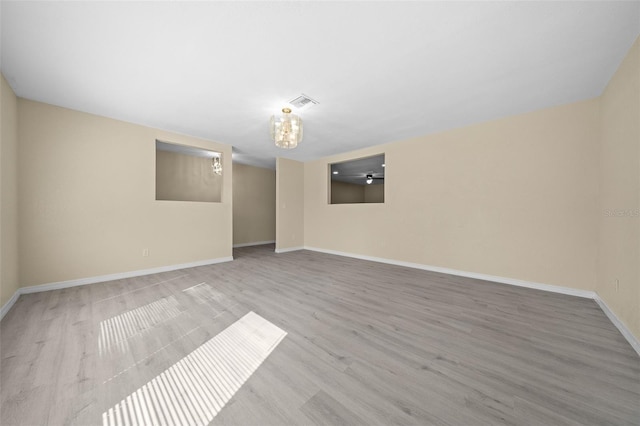 spare room with light hardwood / wood-style floors