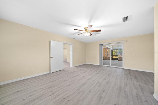 empty room featuring ceiling fan and light hardwood / wood-style flooring