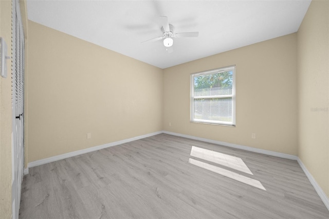 empty room featuring light hardwood / wood-style flooring and ceiling fan