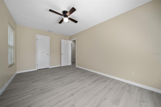 unfurnished bedroom featuring ceiling fan and light wood-type flooring