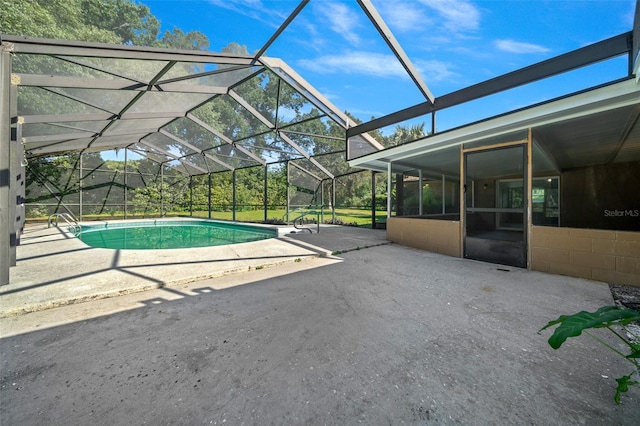 view of pool featuring a patio area and a lanai