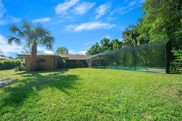 view of yard featuring glass enclosure