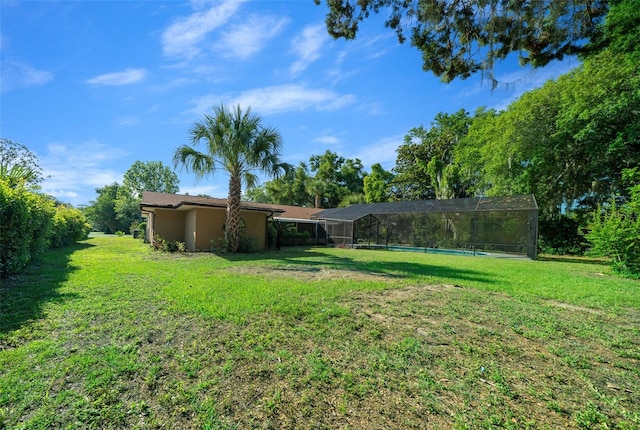 view of yard featuring a lanai