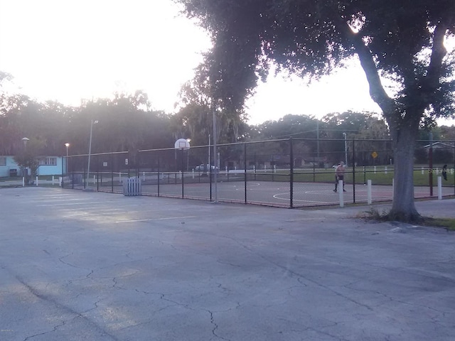 view of property's community featuring basketball court