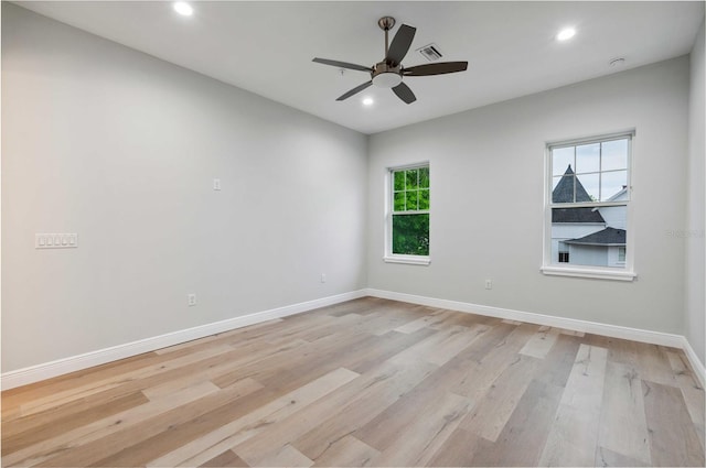 unfurnished room featuring ceiling fan and light hardwood / wood-style floors