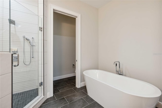 bathroom featuring shower with separate bathtub and tile patterned floors