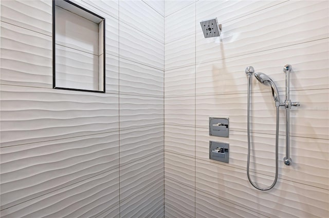 bathroom with a tile shower