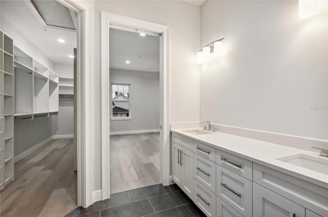 bathroom with tile patterned floors and vanity