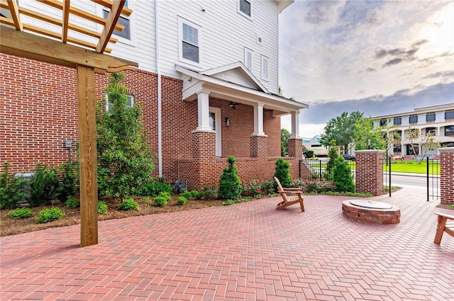 view of patio with an outdoor fire pit