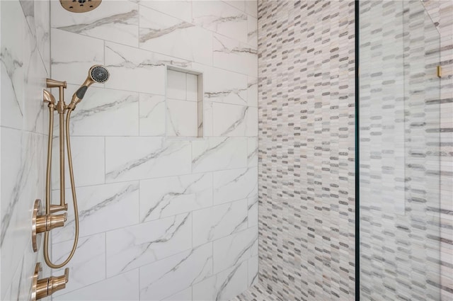 bathroom with a tile shower