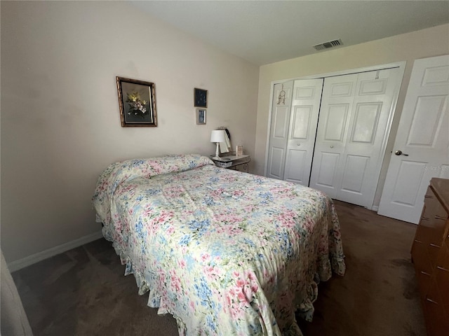 carpeted bedroom featuring a closet