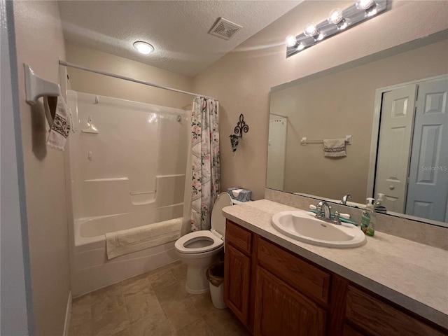 full bathroom with vanity, shower / bath combination with curtain, a textured ceiling, and toilet