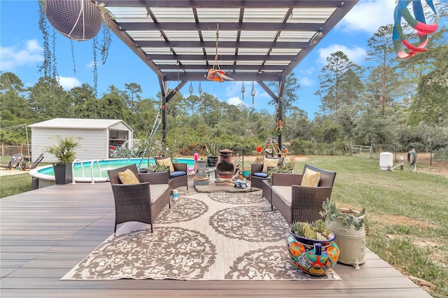 deck featuring an outdoor living space, a pergola, a lawn, and a storage unit