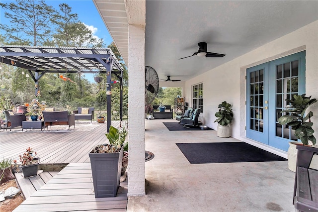 view of patio / terrace featuring ceiling fan, a pergola, outdoor lounge area, a wooden deck, and french doors