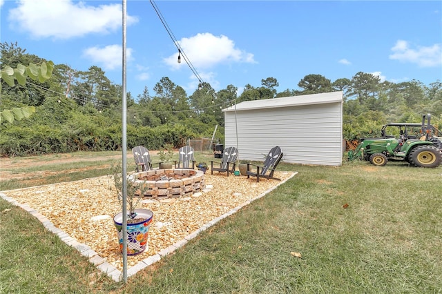 view of yard with an outdoor fire pit