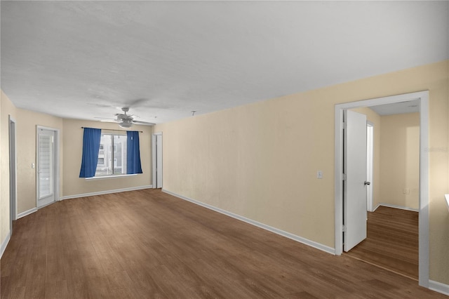 empty room featuring hardwood / wood-style floors and ceiling fan